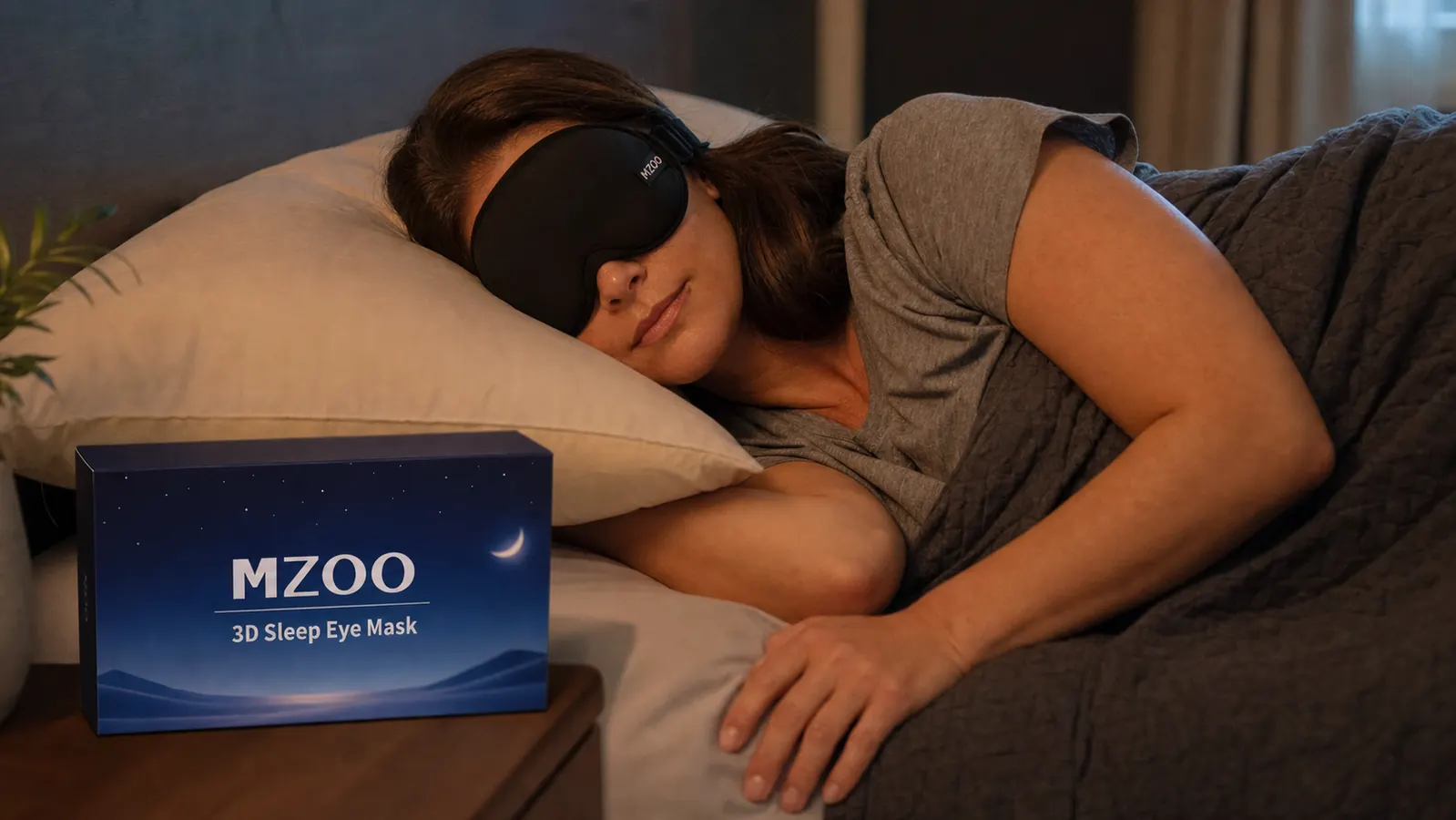 Side sleeper with the MZOO eye mask on, head resting on a pillow, showing how the mask sits against the face from the side